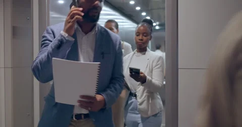 Elevator exit, floor and business people busy in an office for corporate or Stock Footage 246531900