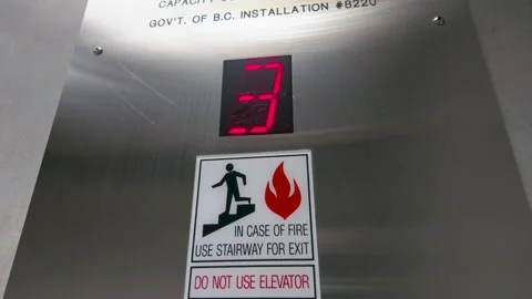 Elevator floor indicator with fire safety evacuation stairway sign Видео 331171094