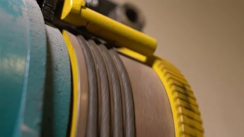 The elevator hoist drum starts to spin and then stops Stock Footage 220713611