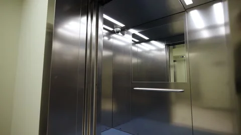 Elevator includes steel walls and parallel ceiling lights Stock Footage 332737171