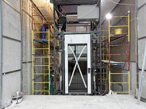 Elevator Installation, Lift Technician Installing a Modern Elevator Stock Photos