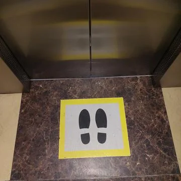 Elevator interior with people standing area sign Stock Photos