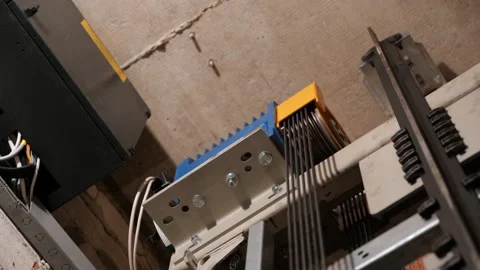 Elevator lift cabin moves up inside illuminated elevator shaft with Stock Footage 138167145
