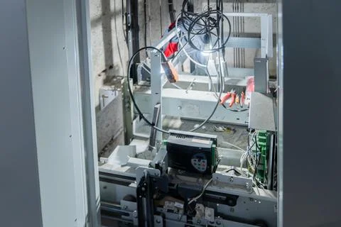 The elevator mechanisms are visible through the open doors, the equipment is Stock Photos