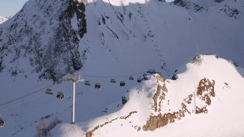 Elevator in mountain resort. People transporting on ski lift in ski resort Stock Footage 122038257