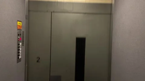 Elevator moves down with moving wall Stock Footage 242172207