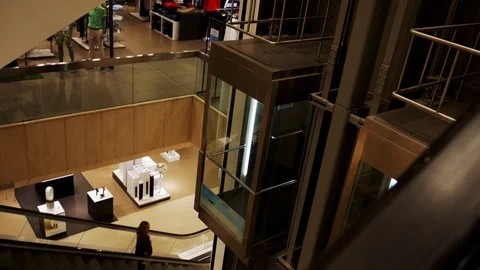 Elevator moving in a mall Stock Footage 112728413