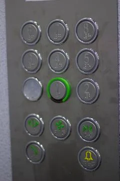 Elevator panel with round buttons with numbers close up Stock Photos