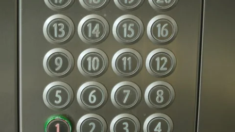 Elevator pushbutton panel while moving, with first floor button active close up. Stock Footage 329225582