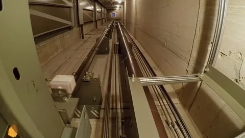 In a elevator shaft, the cabin moves up one floor and stops there. Stock-Footage 88430701