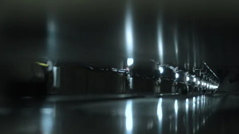 Elevator shaft with guide rails of multi storey building with lights on floors. Stock Footage 247763035
