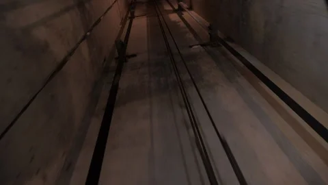 Elevator shaft tunnel. Movement of the Elevator counterweight along the guides. Stock Footage 143152272
