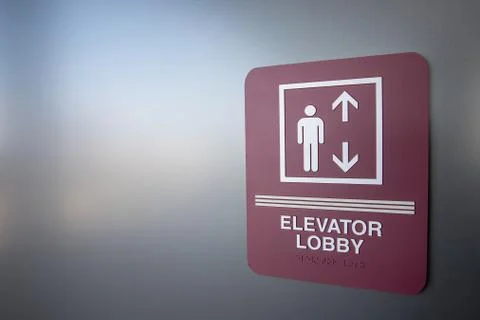 Elevator sign in building Stock Photos