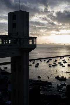 Elevator structure and boats at dusk Stock Photos