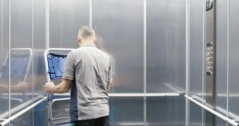 Elevator technician fixing the elevator Stock Footage 308916232