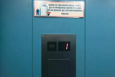 Elevator for three people with a warning in Serbian Stock Photos