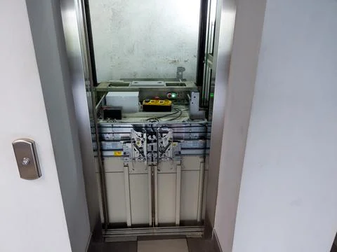 Elevator under maintenance. Broken elevator in open lift shaft. Out of servic Stock Photos