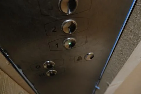 Elevator under renovation buttons first floor metal wood industrial Stock Photos