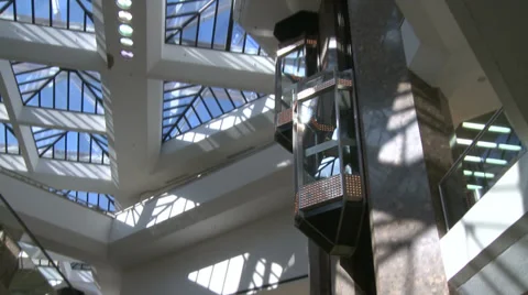 Elevators descending within mall (1 of 2) Stock Footage 32035384