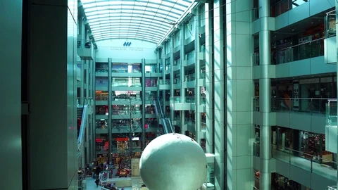 Elevators going up and down in futuristic interior architecture of big multi Stock Footage 97125078