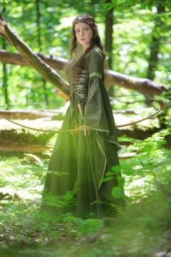 Elf archer with a bow in the forest Stock Photos