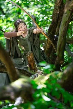 Elf archer with a bow in the forest Stock Photos
