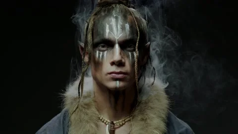 Elf wizard with pattern on face and white smoke around head Stock Footage 163373749