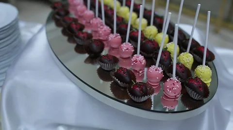 Elicious decorated candy bar, sweets on tables for wedding reception Stock Footage 66443346