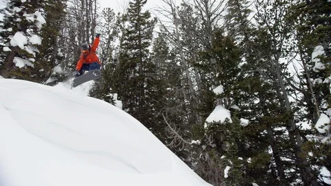 Elite athlete performing stunt on the snow covered mountain slope Stock Footage 116745964