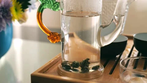 Elite Chinese white tea is brewed in a glass teapot. chinese tea ceremony Stock Footage 220341879