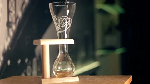 Elite light beer is being poured into a curved glass Stock Footage 61258323