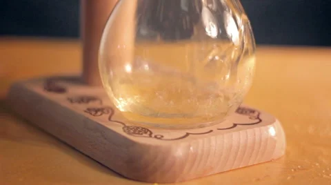 Elite light beer is being poured into a curved glass Stock Footage 61261113