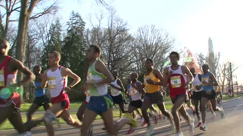 ELITE MEN LEAD PACK RUNNERS WITH WASHINGTON MONUMENT IN BACK - SPORTFILM 10182 Video stock 50793258