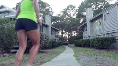Elite runner heads down path to the beach for a run Stock Footage 62892713