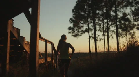 Elite runner trains in the evening at the beach Stock Footage 62892556