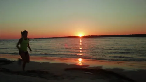 Elite Runner trains by ocean Stock Footage 62926688