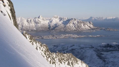 Elite skier cruising down extremely steep mountain face Stock Footage 113225084