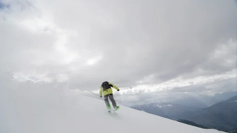 Elite skier cruising down mountain ride Stock Footage 113223119