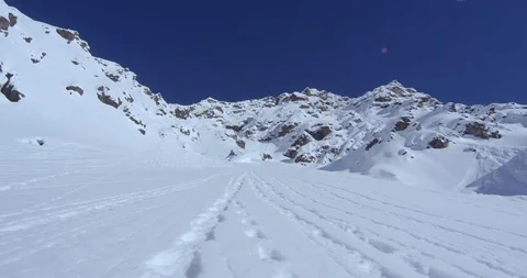 Elite skier cruising down a remote mountain Stock Footage 111992953
