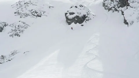 Elite skier cruising down remote mountain face Stock Footage 113216280