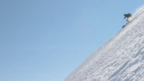 Elite skier cruising down a remote mountain Stock Footage 113257516