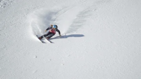 Elite skier cruising down a steep mountain face Stock Footage 113224638