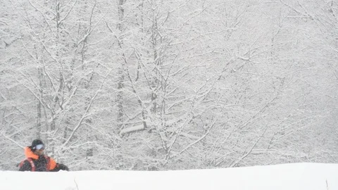 Elite skier cutting through fresh powder snow during a snow storm Stock Footage 113220037