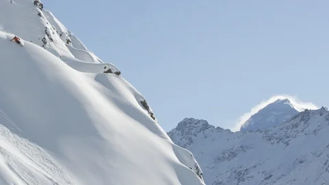 Elite skier cutting through fresh powder on a remote mountain Stock Footage 113244543