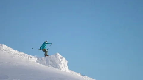 Elite skier performing a 360 spin on a remote mountain slope Stock Footage 113252287
