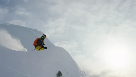 Elite skier performing a backflip on a remote mountain Stock Footage 113251386