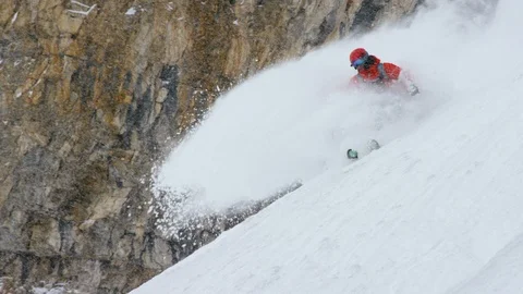 Elite skier skiing downhill during a heavy snowfall Stock Footage 116745994
