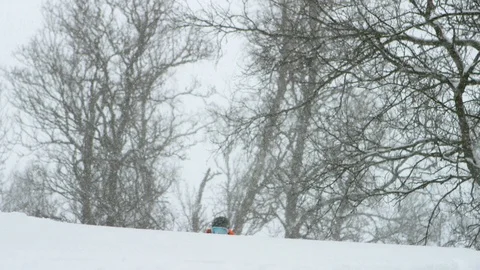 Elite skier skiing during snowfall Stock Footage 116786665