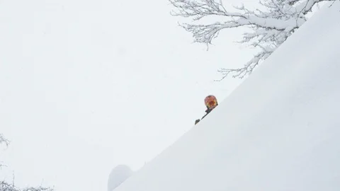 Elite skier skiing during snowfall Stock Footage 116786685