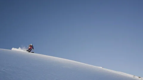 Elite skier speeding down a remote mountain Stock Footage 113225015